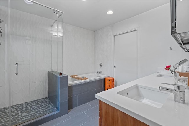1407 Spring Gdn, Austin, TX 78746 - full bathroom with double vanity, a bath, a stall shower, tile patterned floors, and recessed lighting