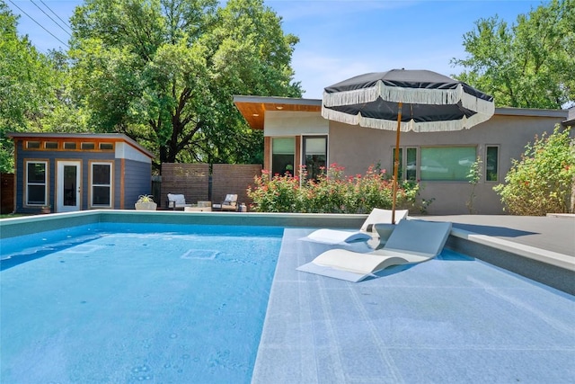 1407 Spring Gdn, Austin, TX 78746 - swimming pool featuring an outbuilding and a storage structure