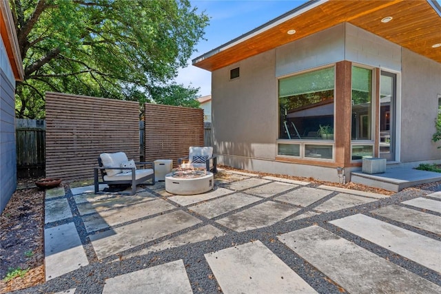 1407 Spring Gdn, Austin, TX 78746 - view of patio / terrace featuring an outdoor fire pit