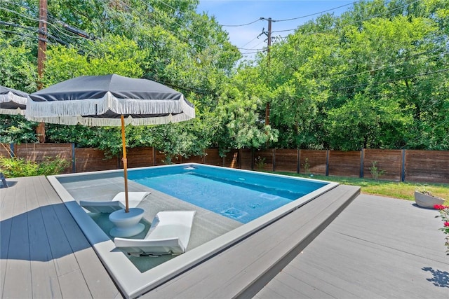 1407 Spring Gdn, Austin, TX 78746 - view of swimming pool featuring a fenced backyard and a wooden deck
