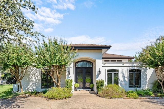 27 Stillmeadow Dr, The Hills, TX 78738 - entrance to property with french doors and stucco siding