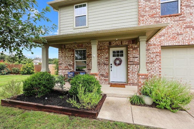 120 Hawkins Ct, Hutto, TX 78634 - view of exterior entry with brick siding and covered porch