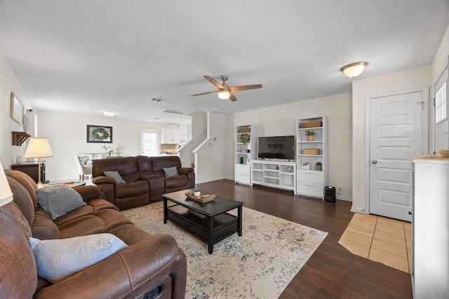 120 Hawkins Ct, Hutto, TX 78634 - living area featuring ceiling fan, dark wood-style flooring, and stairway