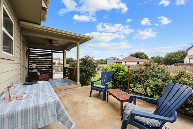 120 Hawkins Ct, Hutto, TX 78634 - fenced backyard featuring ceiling fan and a patio