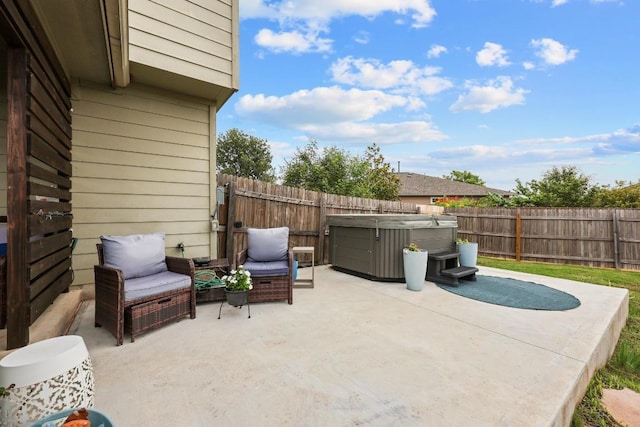 120 Hawkins Ct, Hutto, TX 78634 - fenced backyard featuring a hot tub and a patio area