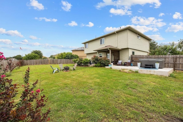 120 Hawkins Ct, Hutto, TX 78634 - back of property with an outdoor fire pit, a hot tub, a patio, and a fenced backyard