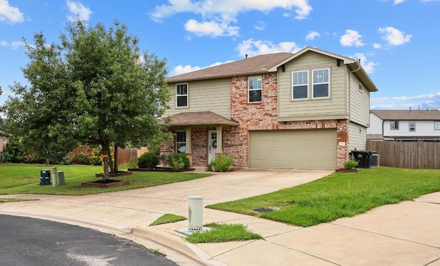 120 Hawkins Ct, Hutto, TX 78634 - view of front of home featuring brick siding, driveway, and an attached garage