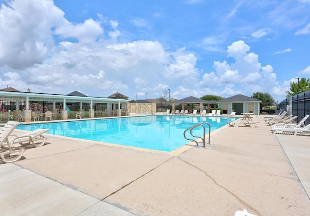 120 Hawkins Ct, Hutto, TX 78634 - community pool with a patio