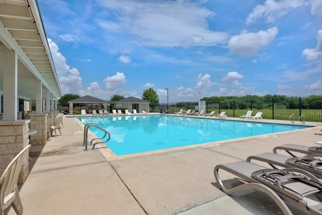 120 Hawkins Ct, Hutto, TX 78634 - community pool with a patio area