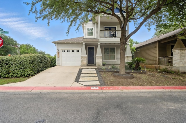 6116 Whipple Way, Austin, TX 78745 - view of front of property with a balcony, an attached garage, stone siding, driveway, and covered porch