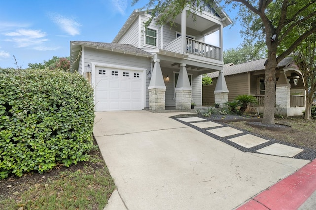 6116 Whipple Way, Austin, TX 78745 - view of front of house with a balcony, stone siding, driveway, and an attached garage