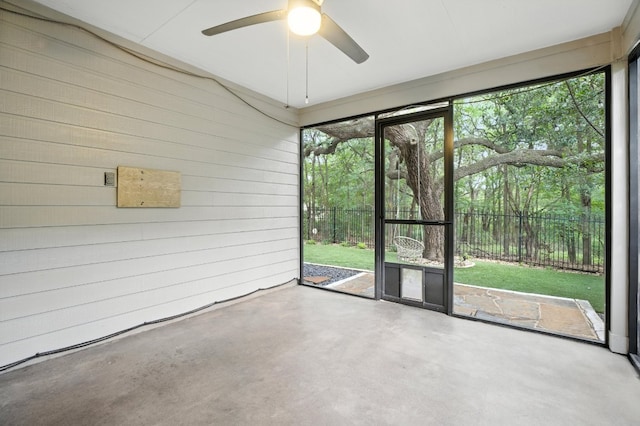 6116 Whipple Way, Austin, TX 78745 - unfurnished room featuring wood walls, concrete flooring, and ceiling fan
