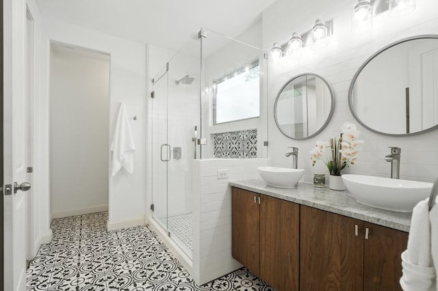 6116 Whipple Way, Austin, TX 78745 - full bathroom featuring a stall shower, double vanity, and tasteful backsplash