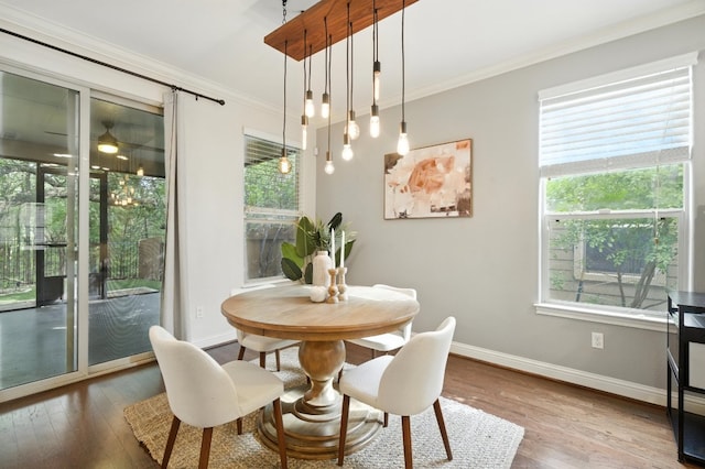 6116 Whipple Way, Austin, TX 78745 - dining area featuring healthy amount of natural light, wood finished floors, and ornamental molding