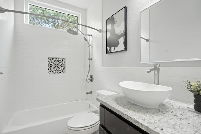 6116 Whipple Way, Austin, TX 78745 - bathroom with tile walls, bathtub / shower combination, vanity, and wainscoting