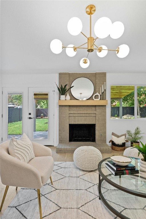 6721 Lost Vly, Austin, TX 78745 - living room featuring a fireplace and a chandelier