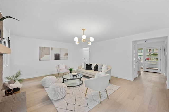 6721 Lost Vly, Austin, TX 78745 - living area with light wood finished floors and a chandelier