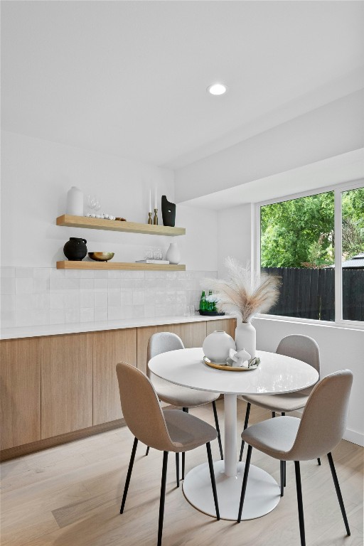 6721 Lost Vly, Austin, TX 78745 - dining room with light wood-style floors and recessed lighting