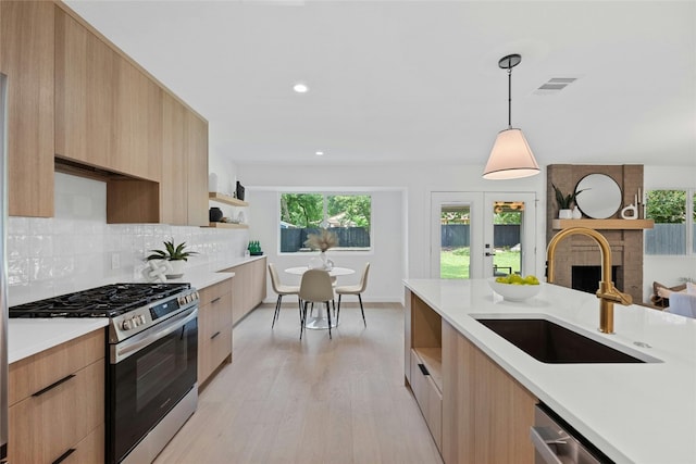 6721 Lost Vly, Austin, TX 78745 - kitchen featuring stainless steel appliances, modern cabinets, light countertops, and recessed lighting
