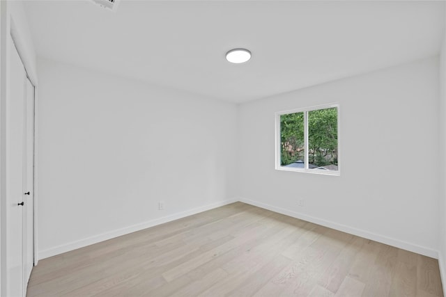 6721 Lost Vly, Austin, TX 78745 - empty room featuring light wood-style floors and baseboards