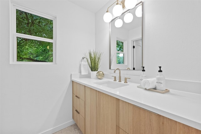 6721 Lost Vly, Austin, TX 78745 - bathroom featuring vanity and baseboards