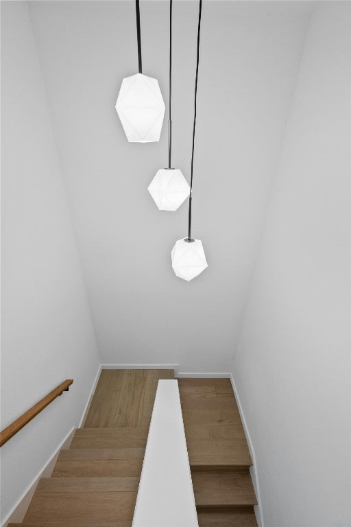 6721 Lost Vly, Austin, TX 78745 - staircase with wood finished floors and baseboards