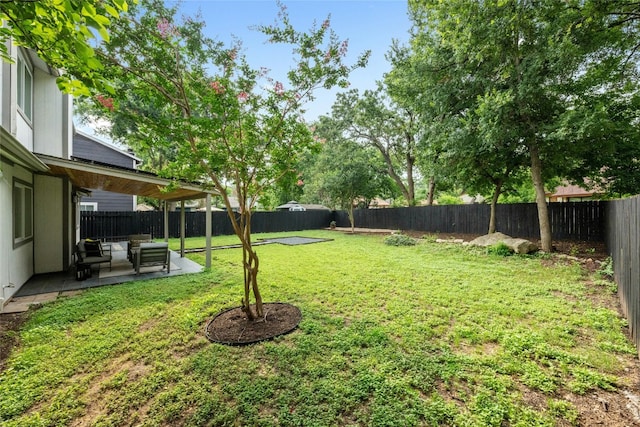 6721 Lost Vly, Austin, TX 78745 - fenced backyard with a patio area and an outdoor living space