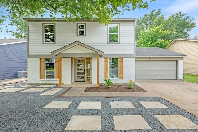 6721 Lost Vly, Austin, TX 78745 - view of front of house featuring an attached garage, brick siding, and driveway