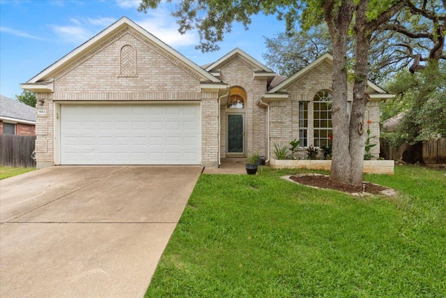 9012 Meacham Way, Austin, TX 78749 - ranch-style home featuring brick siding, driveway, and a garage