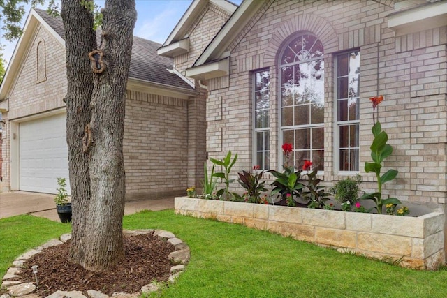 9012 Meacham Way, Austin, TX 78749 - view of side of property featuring brick siding, concrete driveway, and a shingled roof