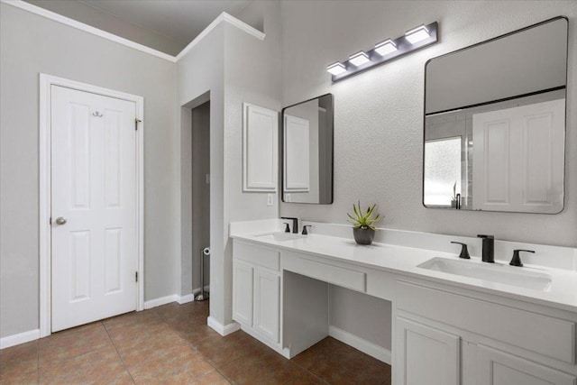 9012 Meacham Way, Austin, TX 78749 - full bathroom with double vanity, tile patterned floors, and crown molding