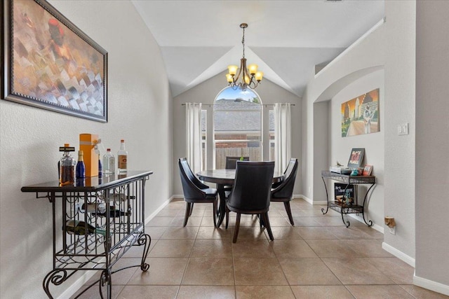 9012 Meacham Way, Austin, TX 78749 - tiled dining space featuring a chandelier and vaulted ceiling