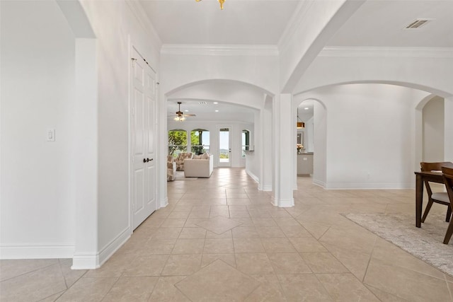 1500 El Cielo, Leander, TX 78641 - entrance foyer featuring a ceiling fan, crown molding, arched walkways, and light tile patterned flooring