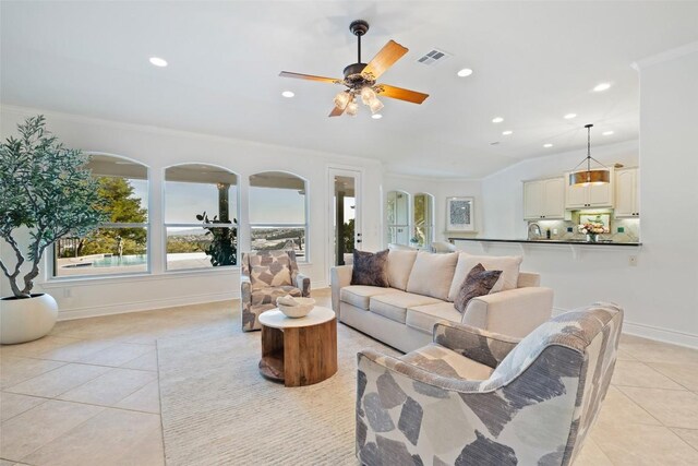 1500 El Cielo, Leander, TX 78641 - living area with light tile patterned floors, recessed lighting, a ceiling fan, and ornamental molding