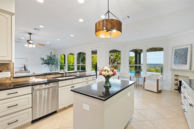 1500 El Cielo, Leander, TX 78641 - kitchen featuring dishwasher, plenty of natural light, light tile patterned floors, backsplash, and recessed lighting