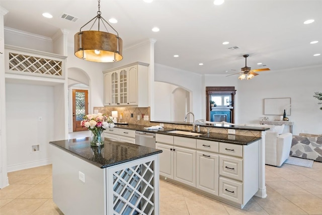 1500 El Cielo, Leander, TX 78641 - kitchen featuring arched walkways, open floor plan, plenty of natural light, ornamental molding, and recessed lighting