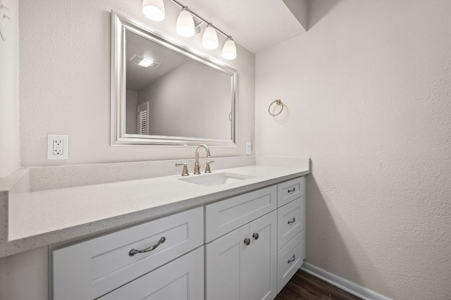 11705 Oak Trl, Austin, TX 78753 - bathroom featuring vanity and wood finished floors