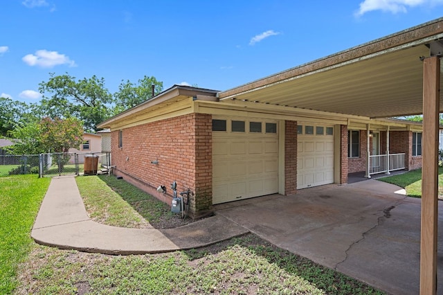 11705 Oak Trl, Austin, TX 78753 - view of side of home featuring brick siding, a garage, and concrete driveway