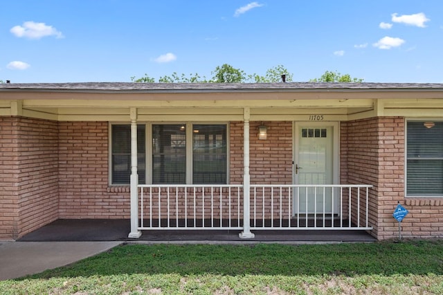 11705 Oak Trl, Austin, TX 78753 - view of exterior entry featuring brick siding and covered porch