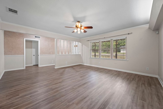 11705 Oak Trl, Austin, TX 78753 - spare room featuring ceiling fan, wood finished floors, and crown molding