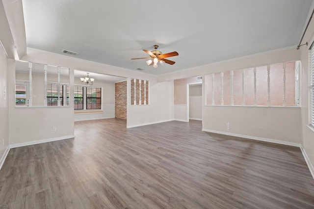11705 Oak Trl, Austin, TX 78753 - unfurnished living room with a ceiling fan, a chandelier, wood finished floors, and ornamental molding