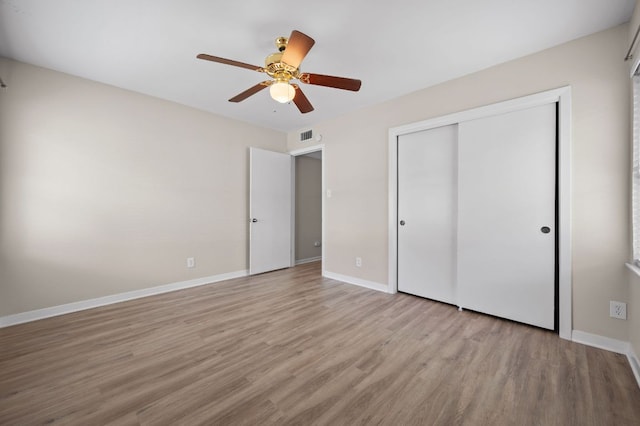 11705 Oak Trl, Austin, TX 78753 - unfurnished bedroom featuring wood finished floors, a closet, and ceiling fan