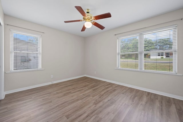 11705 Oak Trl, Austin, TX 78753 - spare room with light wood finished floors and a ceiling fan