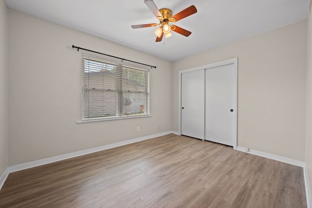 11705 Oak Trl, Austin, TX 78753 - unfurnished bedroom with wood finished floors, a closet, and ceiling fan