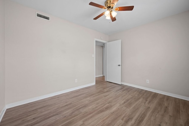 11705 Oak Trl, Austin, TX 78753 - spare room with wood finished floors and ceiling fan