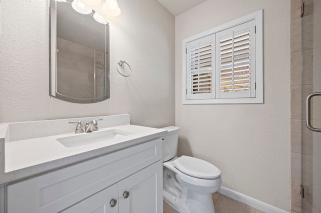 11705 Oak Trl, Austin, TX 78753 - bathroom with vanity, tiled shower, tile patterned flooring, and a textured wall