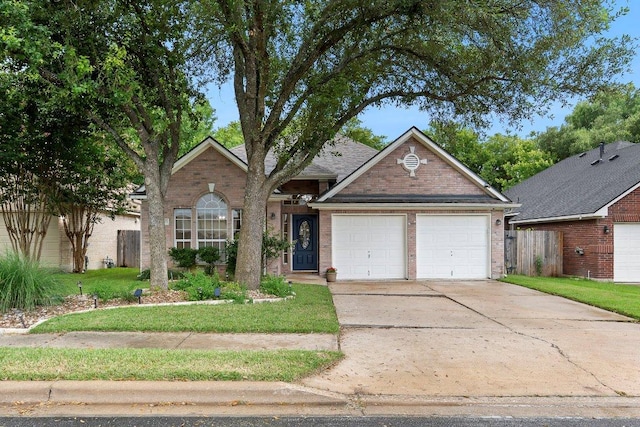 13121 Armaga Springs Rd, Austin, TX 78727 - single story home with brick siding, a garage, and driveway