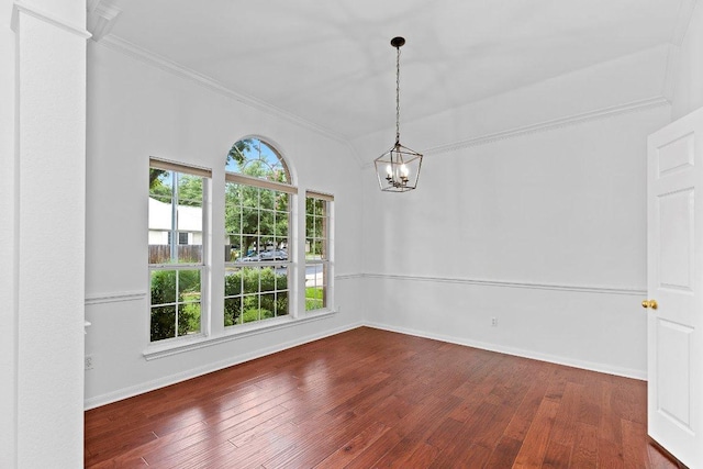 13121 Armaga Springs Rd, Austin, TX 78727 - spare room featuring ornamental molding, a chandelier, and hardwood / wood-style floors