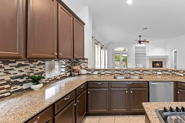 13121 Armaga Springs Rd, Austin, TX 78727 - kitchen featuring ceiling fan, decorative backsplash, appliances with stainless steel finishes, light stone counters, and recessed lighting