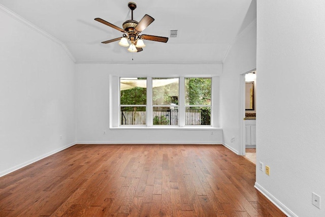 13121 Armaga Springs Rd, Austin, TX 78727 - unfurnished room featuring ornamental molding, a ceiling fan, hardwood / wood-style flooring, and vaulted ceiling
